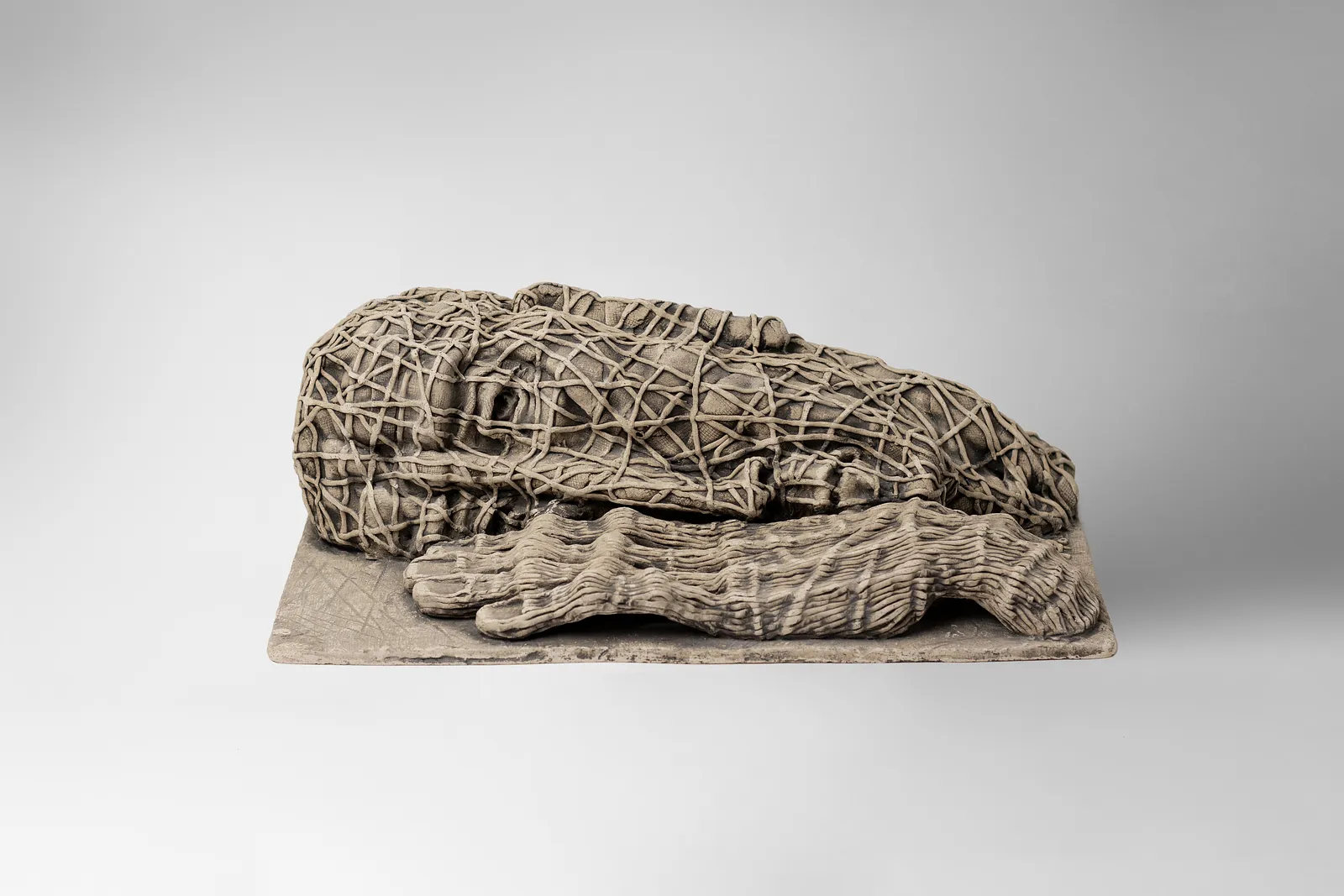 Image of The one who lying down by Liudmyla Davydenko, size: 38х21х12, made of chamotte, glaze, Sculpture medium, part of the Holova/Head series, priced at €1000 Photo 1 of 3.